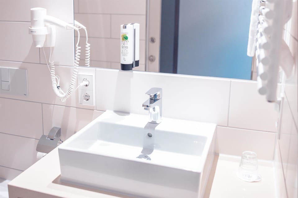 Shower, eco-friendly toiletries, hair dryer, towels