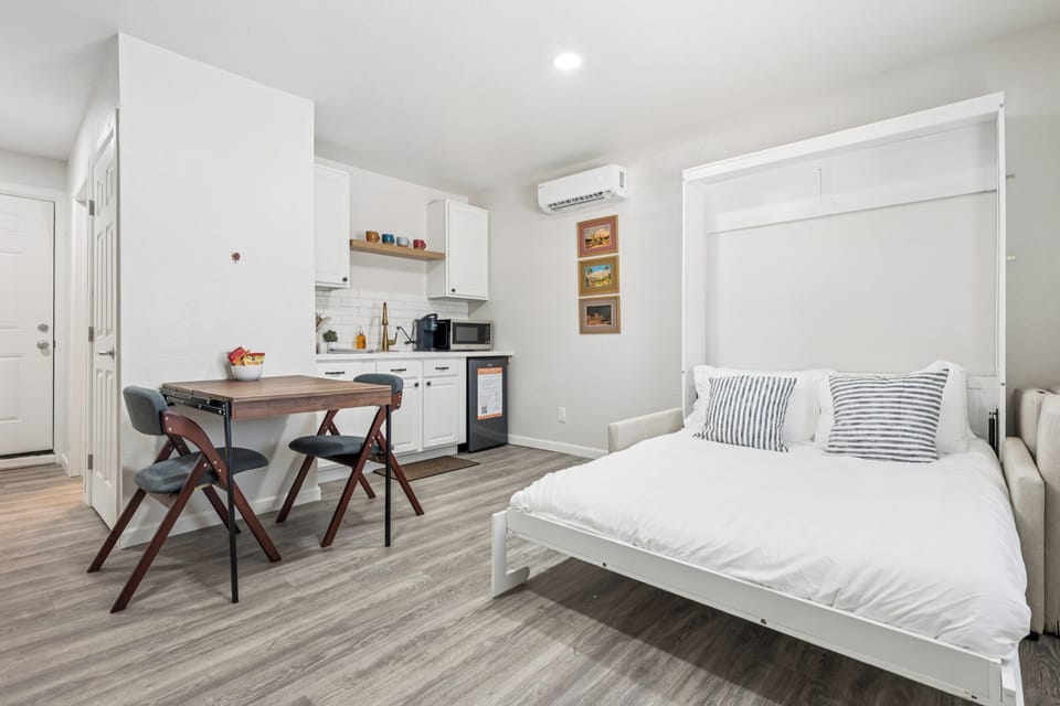 Enjoy the cozy queen-size bed that folds away during the day for living room seating