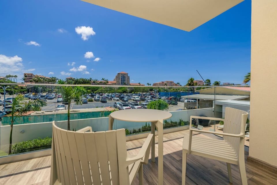 Our balcony, complete with a table and chairs, is the perfect spot for morning coffee, evening drinks, or simply soaking up the views. Enjoy the fresh air and create memorable moments outdoors.