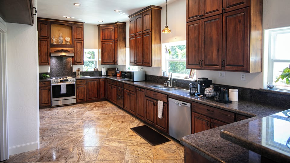 Chef's Kitchen -Labradorite Stone Counters, Stainless Steel, Open to Ocean Views