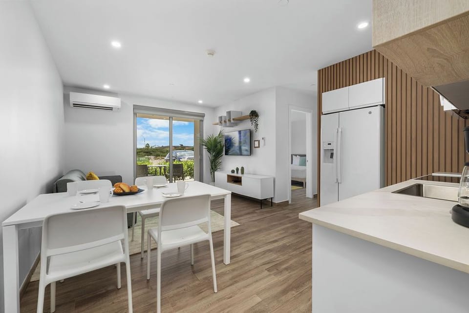 Our open-concept living, dining, and kitchen area makes it easy to enjoy meals together. Cook up a feast in the fully equipped kitchen, then gather around the dining table to make lasting memories.