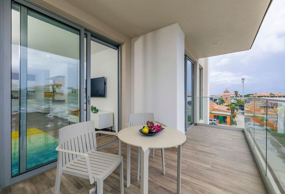 Step outside and breathe easy! Our living room opens up to a private balcony, the perfect spot for your morning coffee, a sunset cocktail, or simply enjoying the fresh air. It's your personal outdoor escape, just steps away.