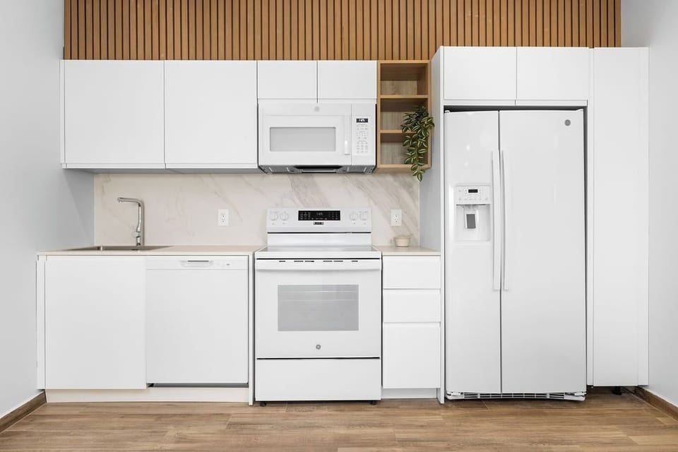 Cook up your favorites in a full kitchen equipped with sleek, modern appliances — everything you need for home-style meals while you travel.
