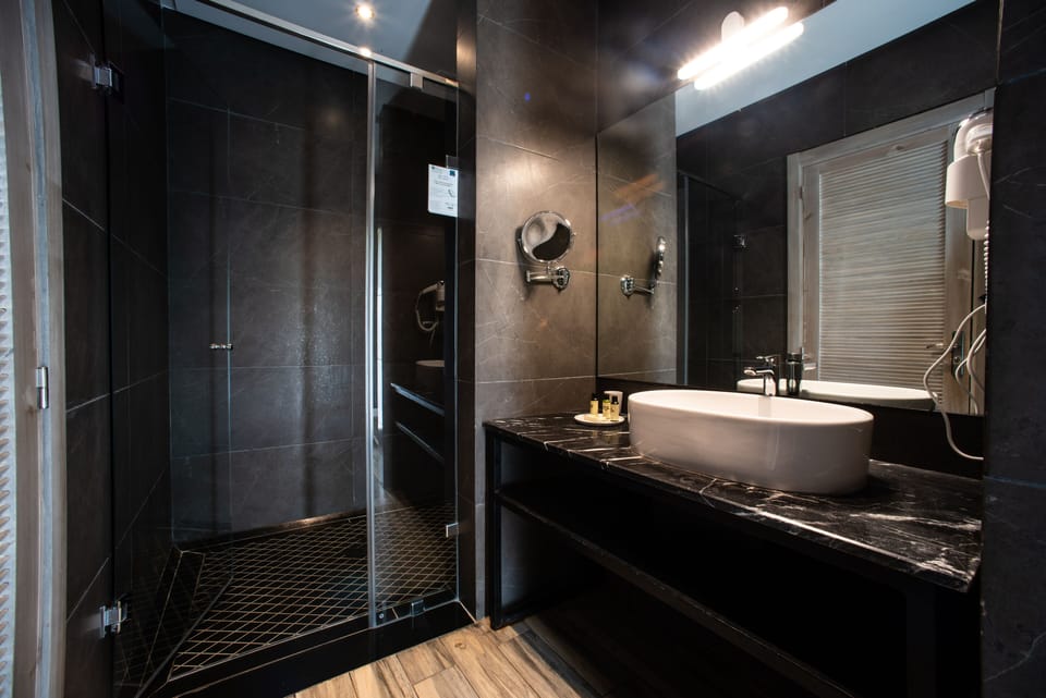 Hydromassage showerhead, designer toiletries, hair dryer, slippers