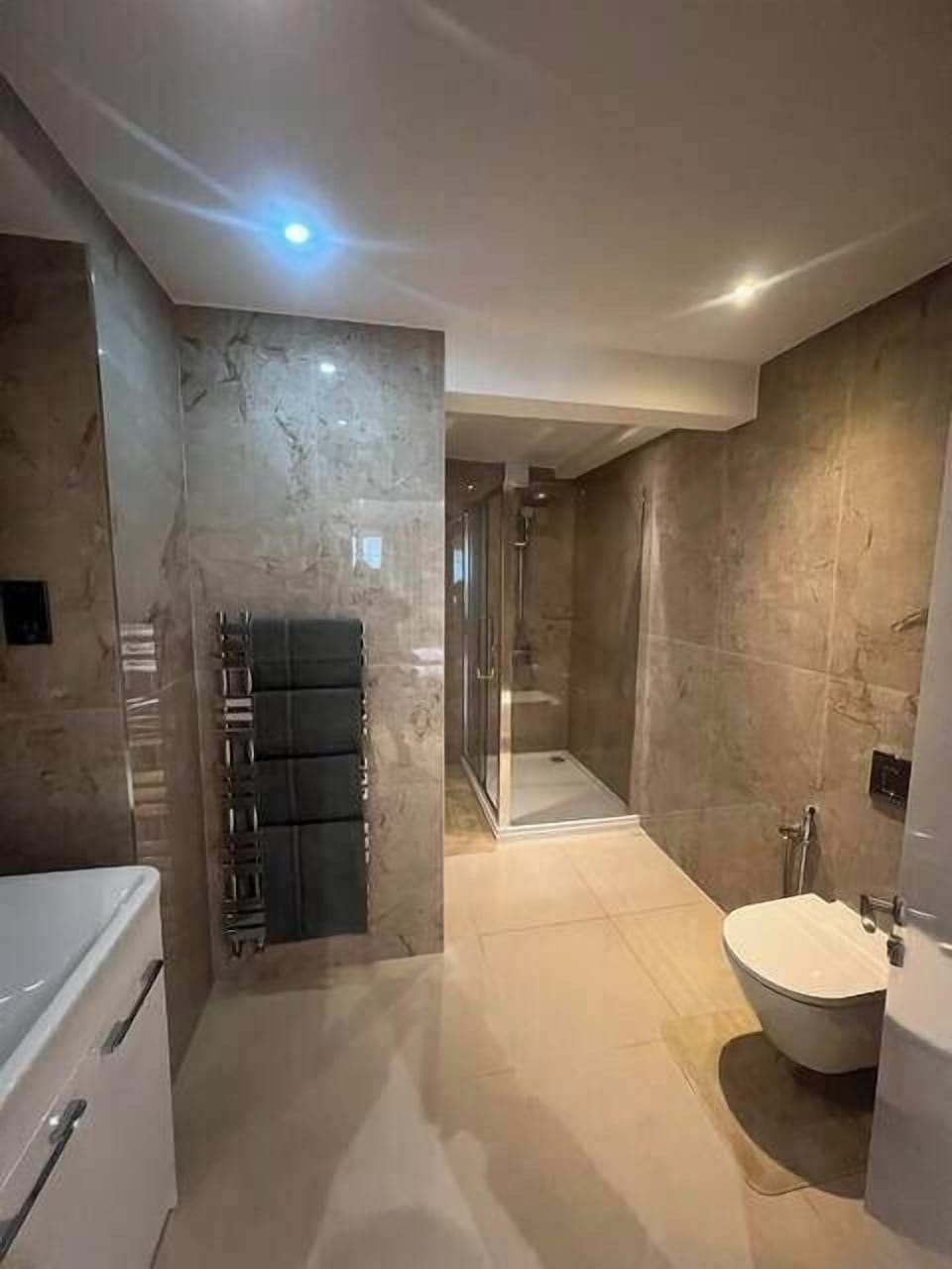 Start your day off right with a rejuvenating routine in our sleek attached bathroom