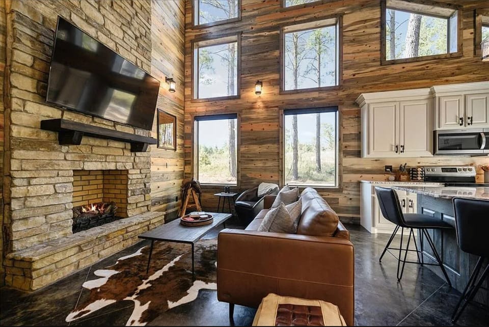 Rustic-modern lounge with fireplace centerpiece