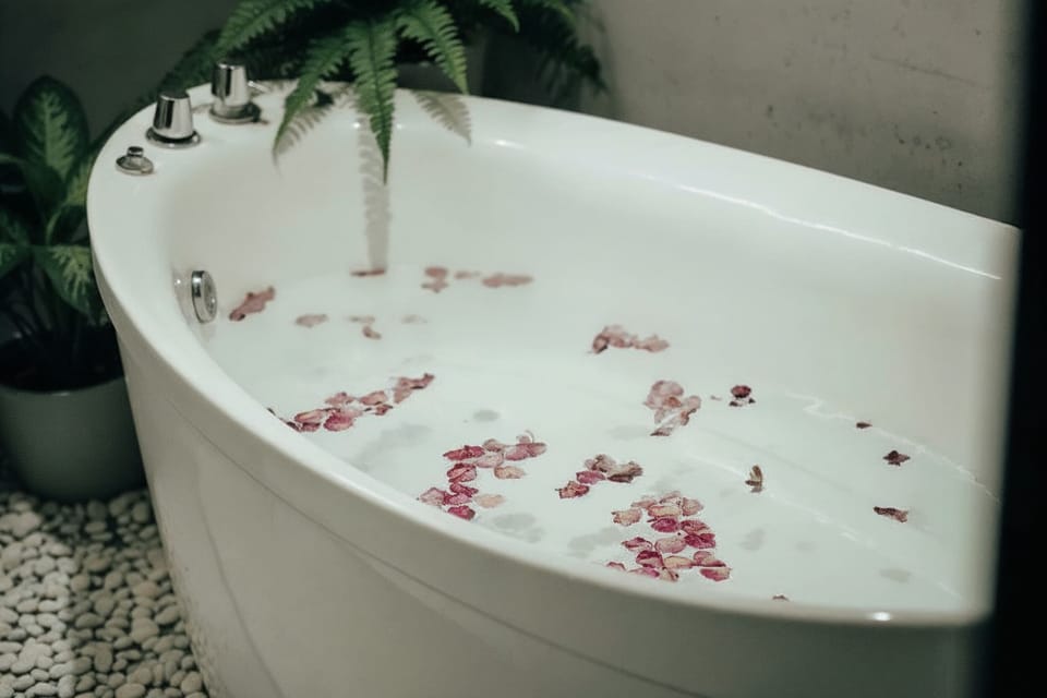 Deluxe Quadruple Room, Pool View | Bathroom | Hair dryer, towels, soap, shampoo