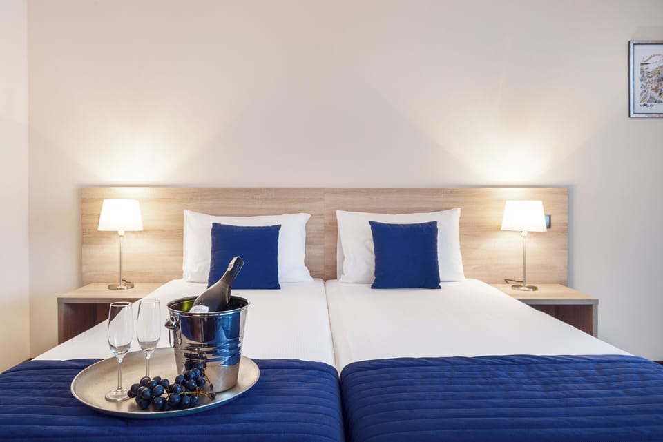 Premium bedding, down comforters, in-room safe, desk