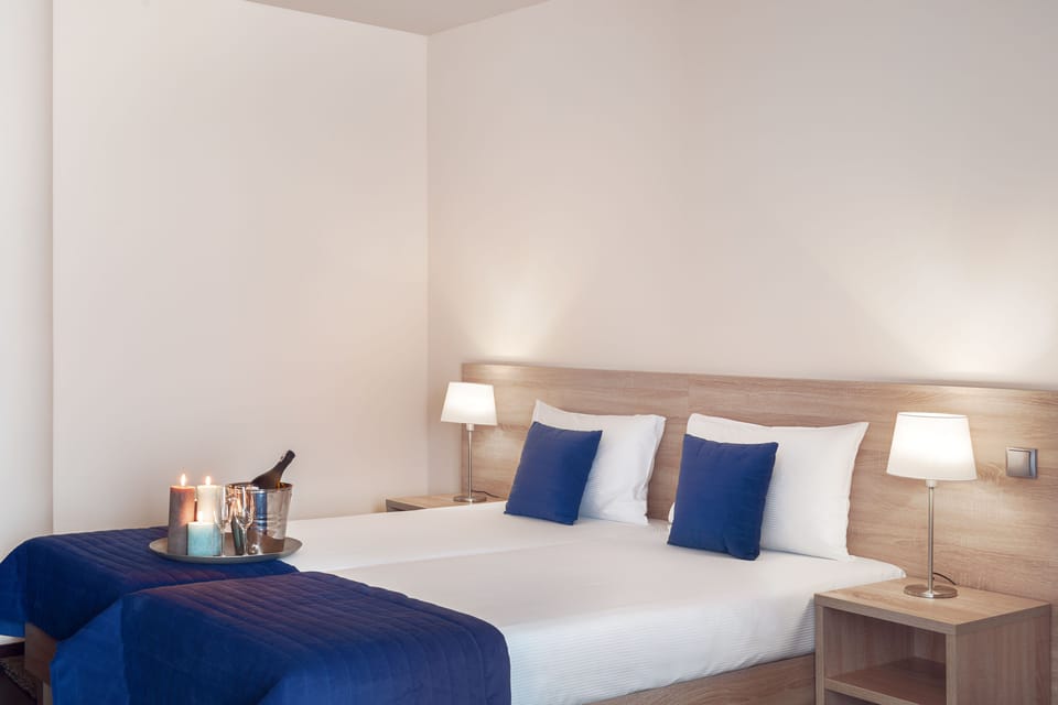 Premium bedding, down comforters, in-room safe, desk