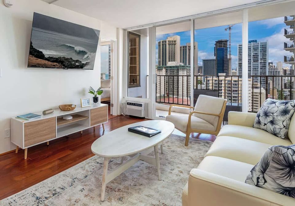 Our living room area is a wonderful spot to relax - enjoy lounging on the leather sofa with a favorite book , watching a favorite movie on the 65" Roku TV, or taking in the city and ocean views.  