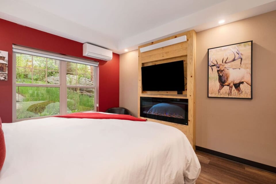 Big king bed and electric fireplace.