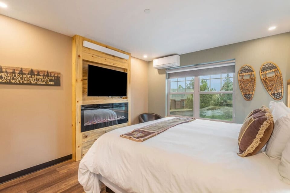 Mountain themed decor with smart TV and electric fireplace