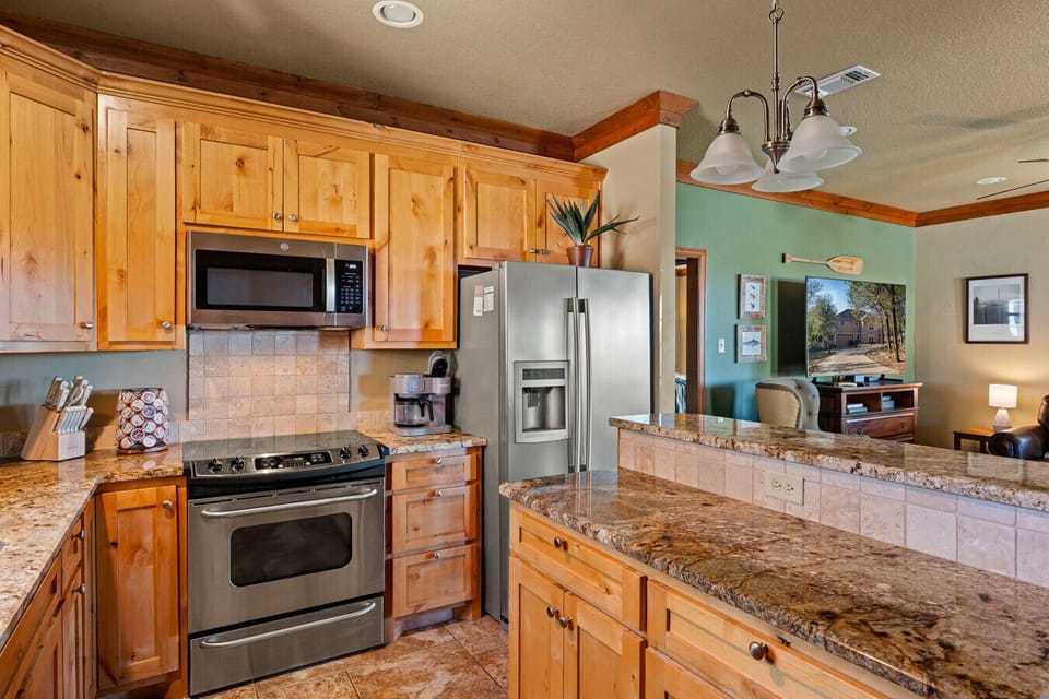 Spacious Kitchen | Granite Countertops | Stainless Steel Appliances | Warm Wood Cabinetry