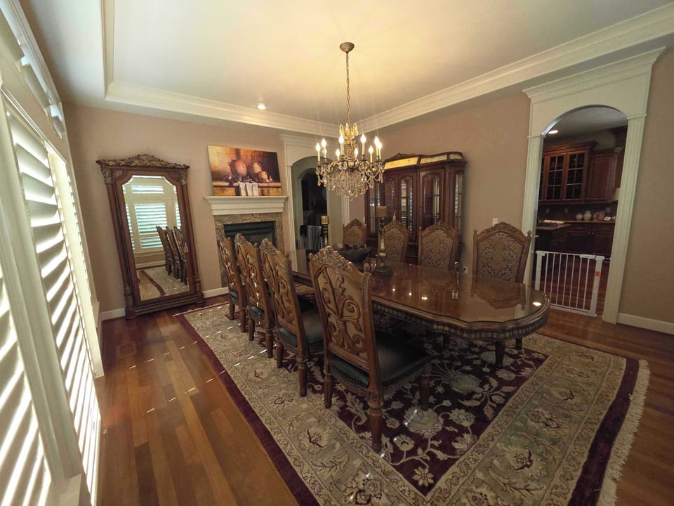 featuring a crystal chandelier and seating for eight