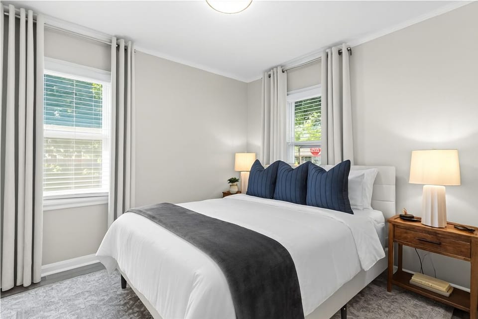 Cozy bedroom with queen bed and soft linens for restful nights