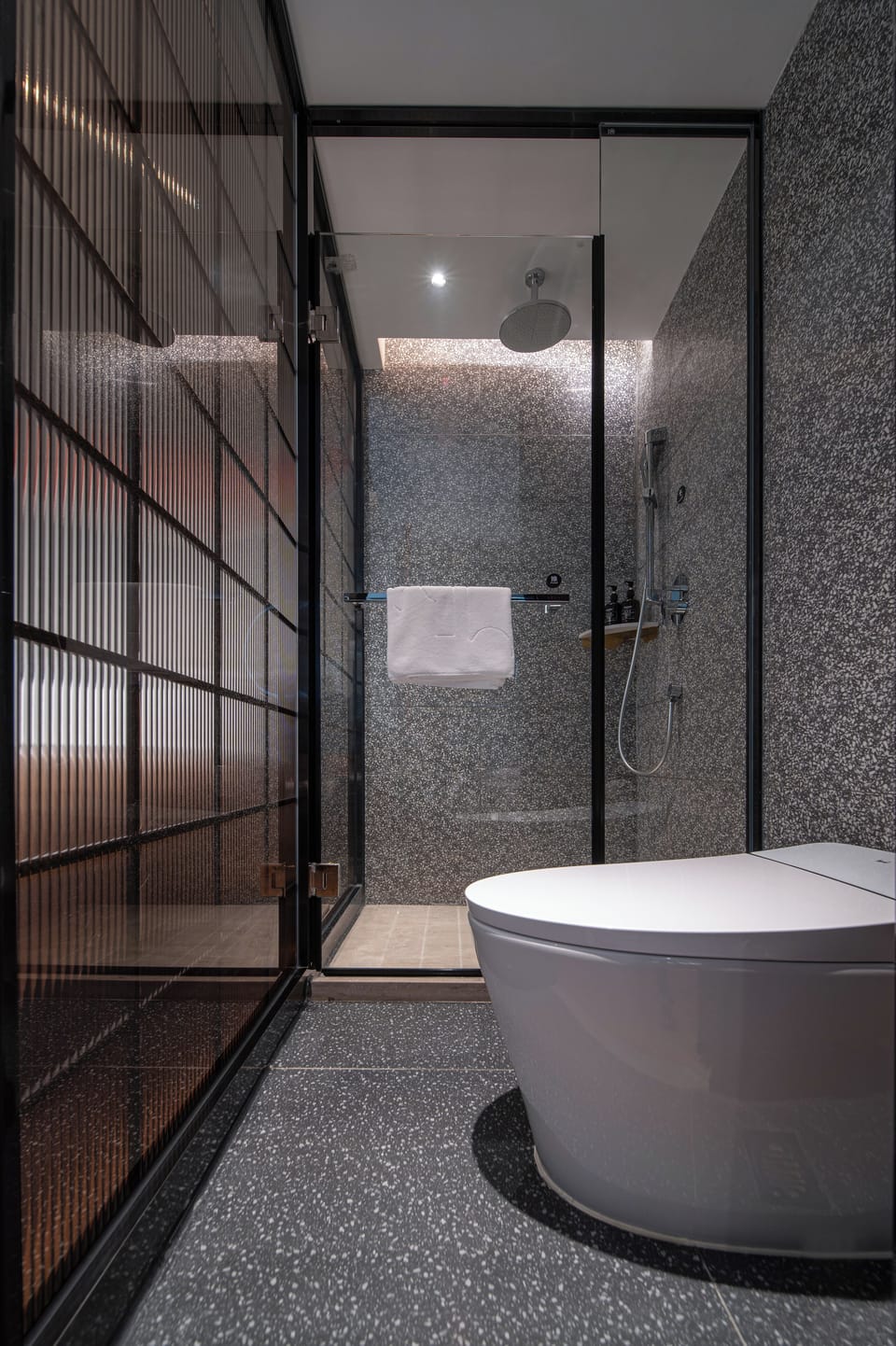 Shower, hair dryer, slippers, towels