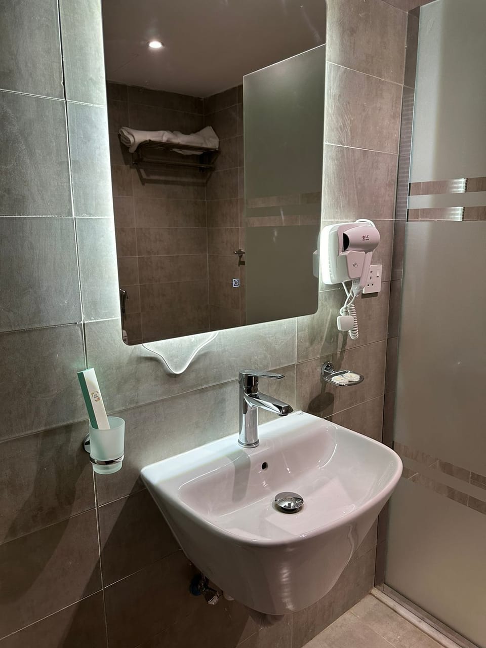 Hair dryer, slippers, towels, soap