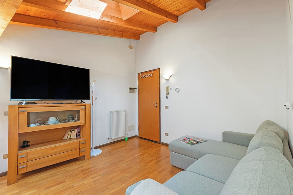 Family Apartment, Multiple Bedrooms (Skylight) | Living area | 21-inch flat-screen TV with cable channels