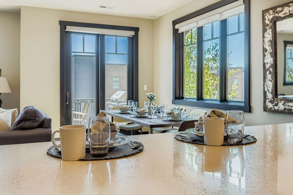 Whip up local delicacies in this sleek, modern kitchen at Blackstone. Enjoy stainless steel appliances, elegant pendant lighting, and a spacious breakfast bar perfect for quick morning bites.