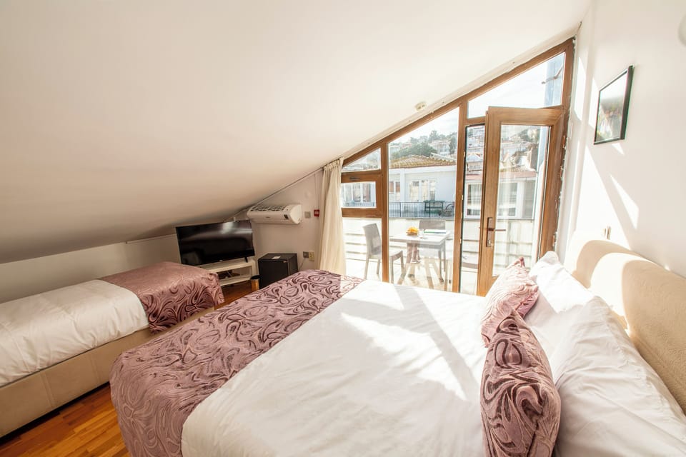 Family Loft, Balcony | Premium bedding, minibar, in-room safe, blackout drapes