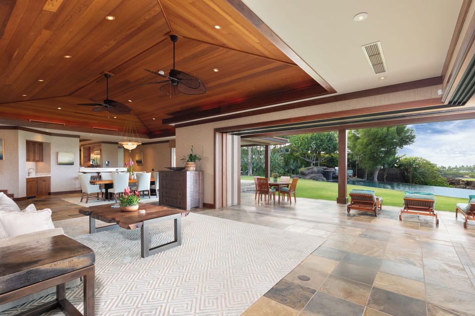 Open-concept great room flows effortlessly to outdoor lounge and poolside seating.