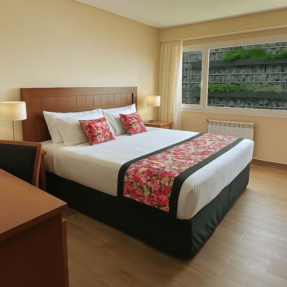 Drift off comfortably in crisp linens and soft bedside lighting.