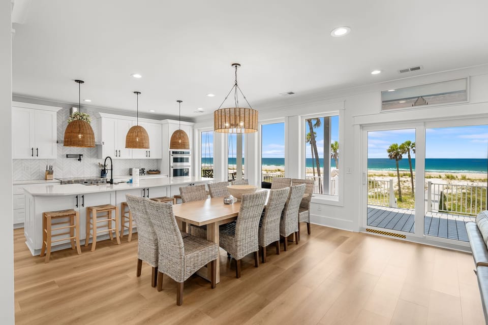 Your spacious kitchen and dining area opens to stunning ocean views, where you'll savor meals while watching waves roll in through floor-to-ceiling windows.
