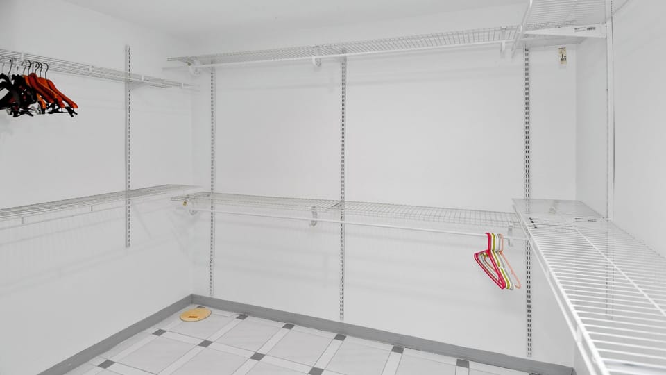 Walk-in closet with ample space and convenient shelving options