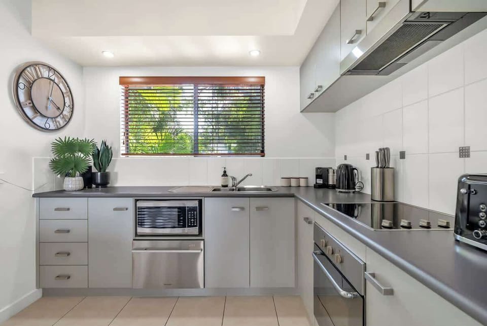 Prepare easy meals in the full-size kitchen, complete with an oven, fridge, microwave, generous bench space, and all the cooking essentials you need.