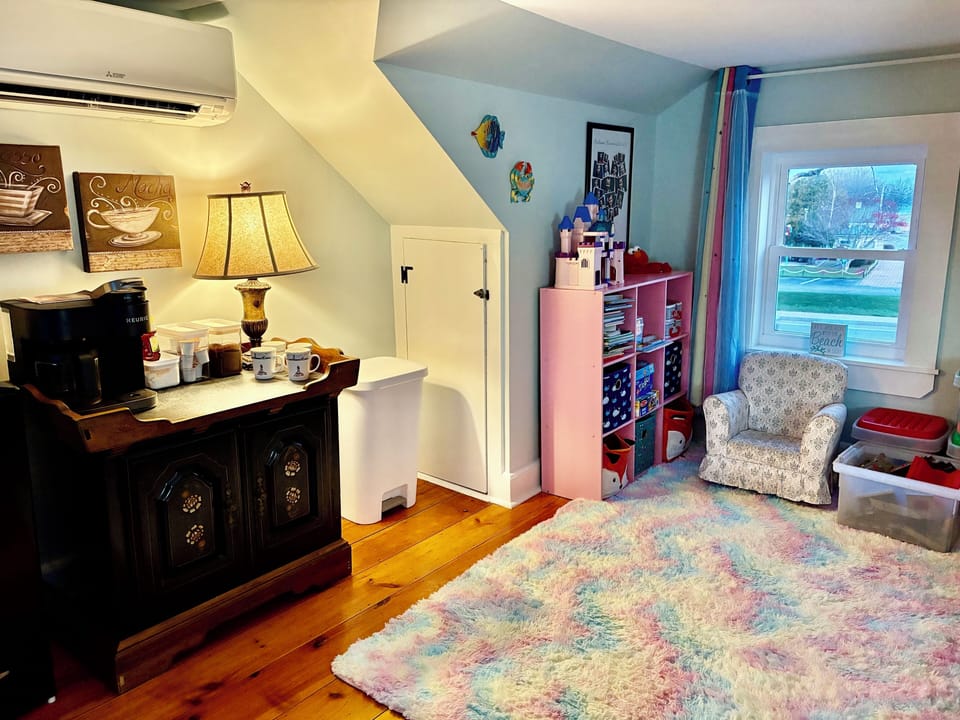 2nd room: twin bed, play area, dining table, fridge, microwave & coffee bar