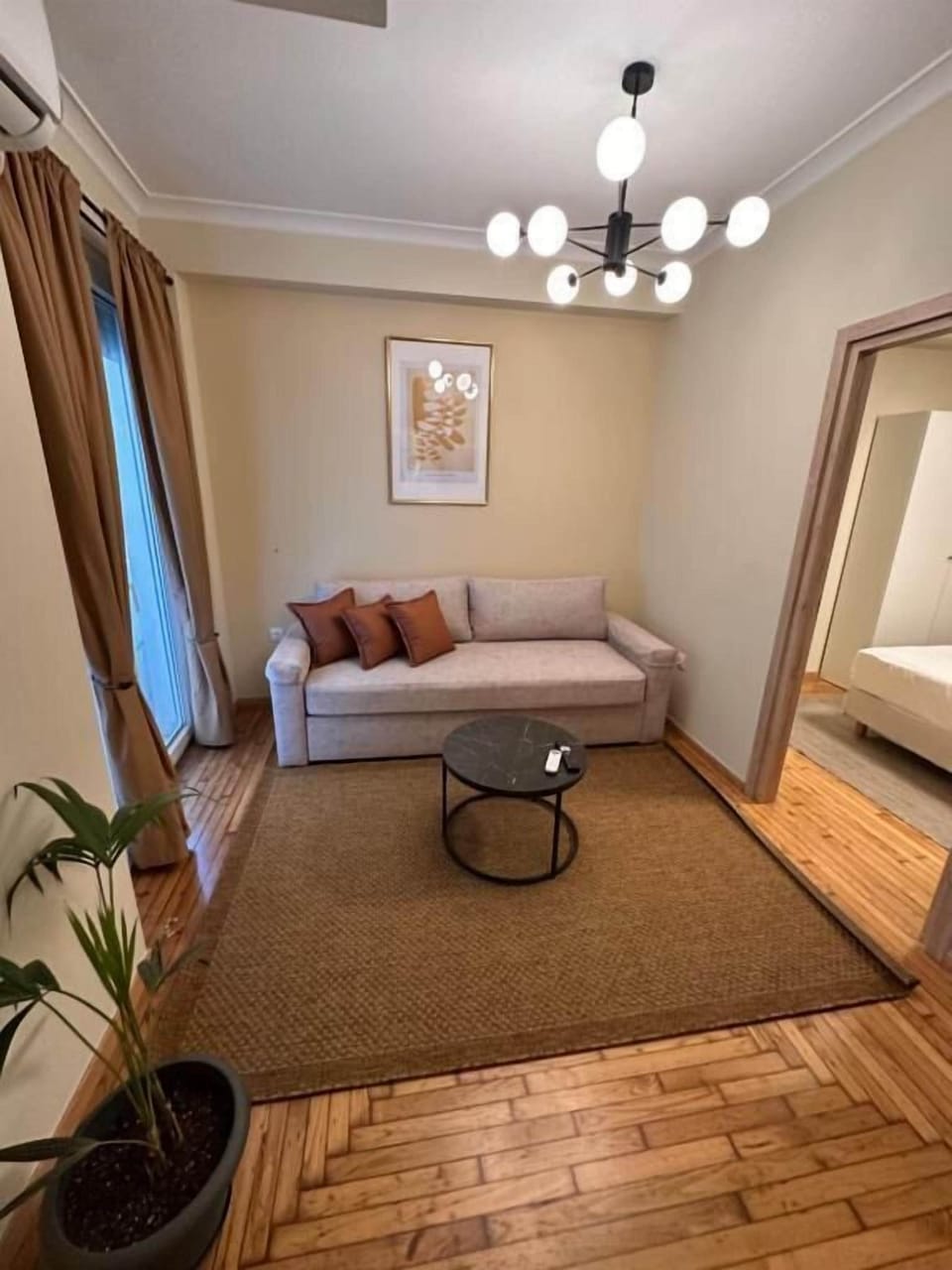 Deluxe Apartment, Balcony, Courtyard View | Living area | Flat-screen TV