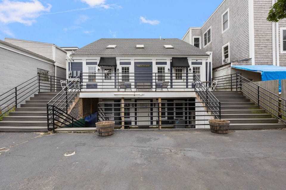 View from parking lot showing entrances to units 1 & 2 (upstairs) and units 3 & 4 (downstairs)