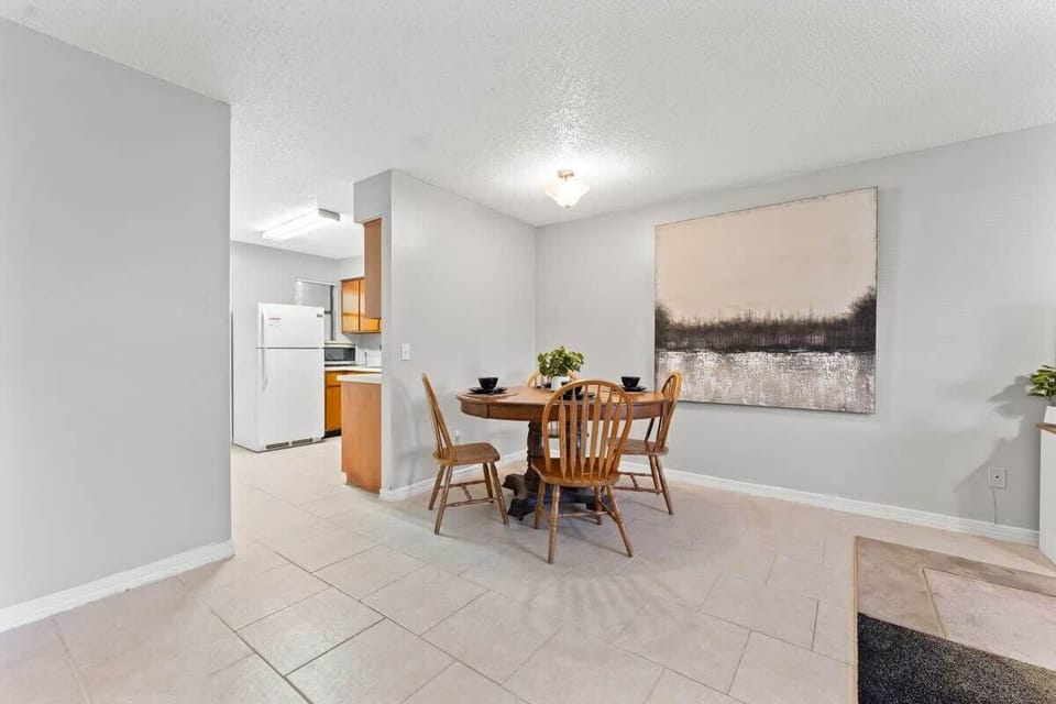 Dining Area
- 4 chairs and place settings
- Open space design
