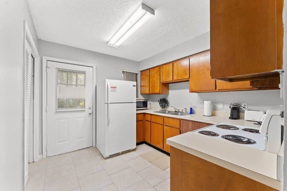 Kitchen offers full size refrigerator, stove/oven, microwave, toaster, toaster oven, Keurig coffee maker, pots & pans, and more.