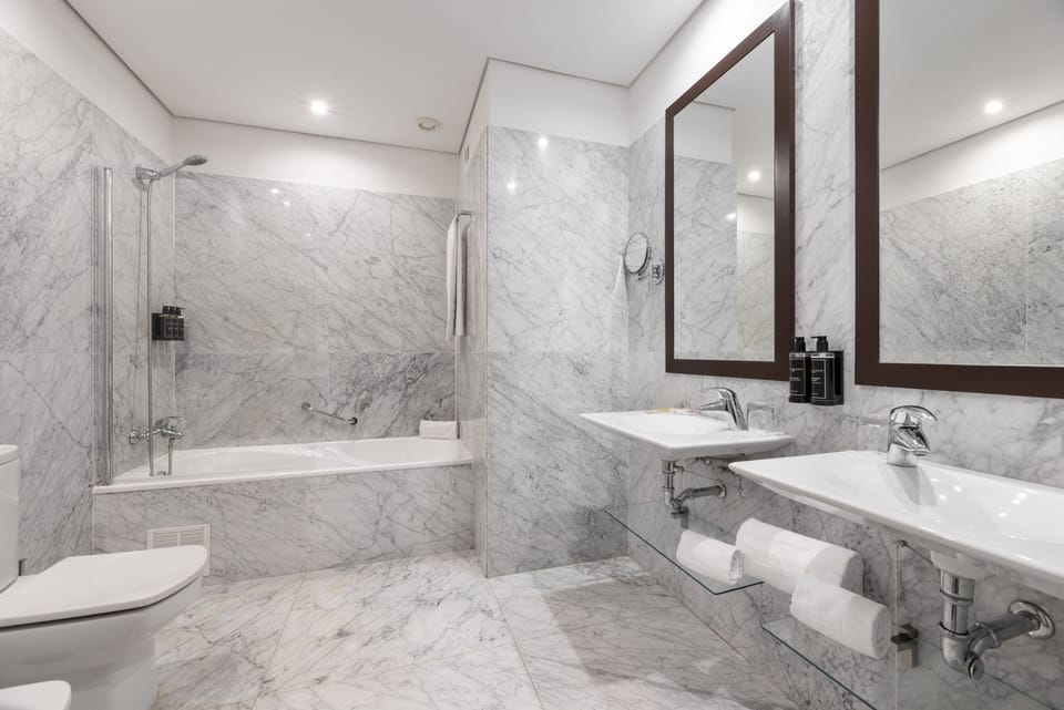 Eco-friendly toiletries, hair dryer, bidet, towels