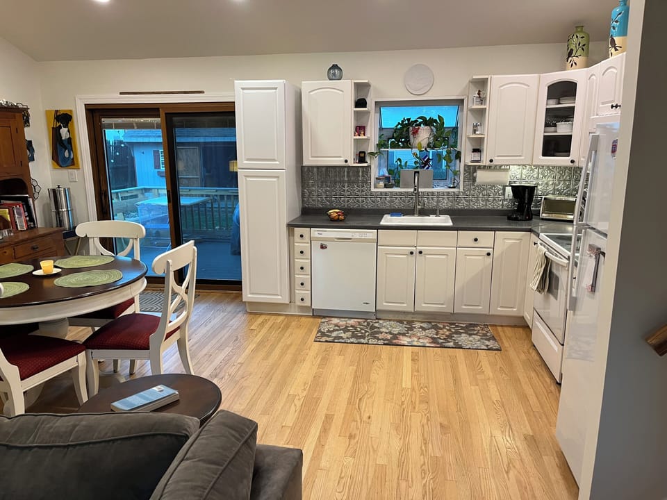 Kitchen, dining and door to deck.