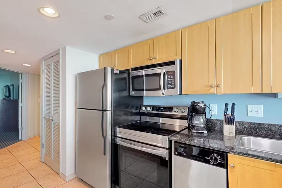 . Fully equipped kitchen with modern stainless steel appliances