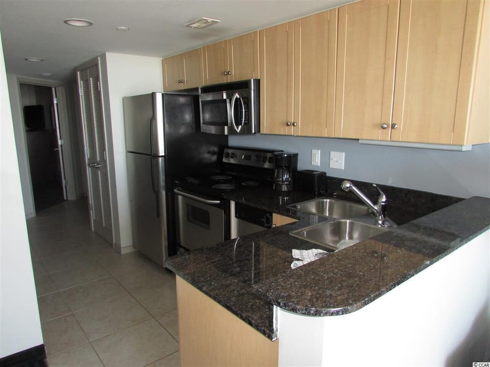 Modern kitchen with stainless steel appliances and ample counter space