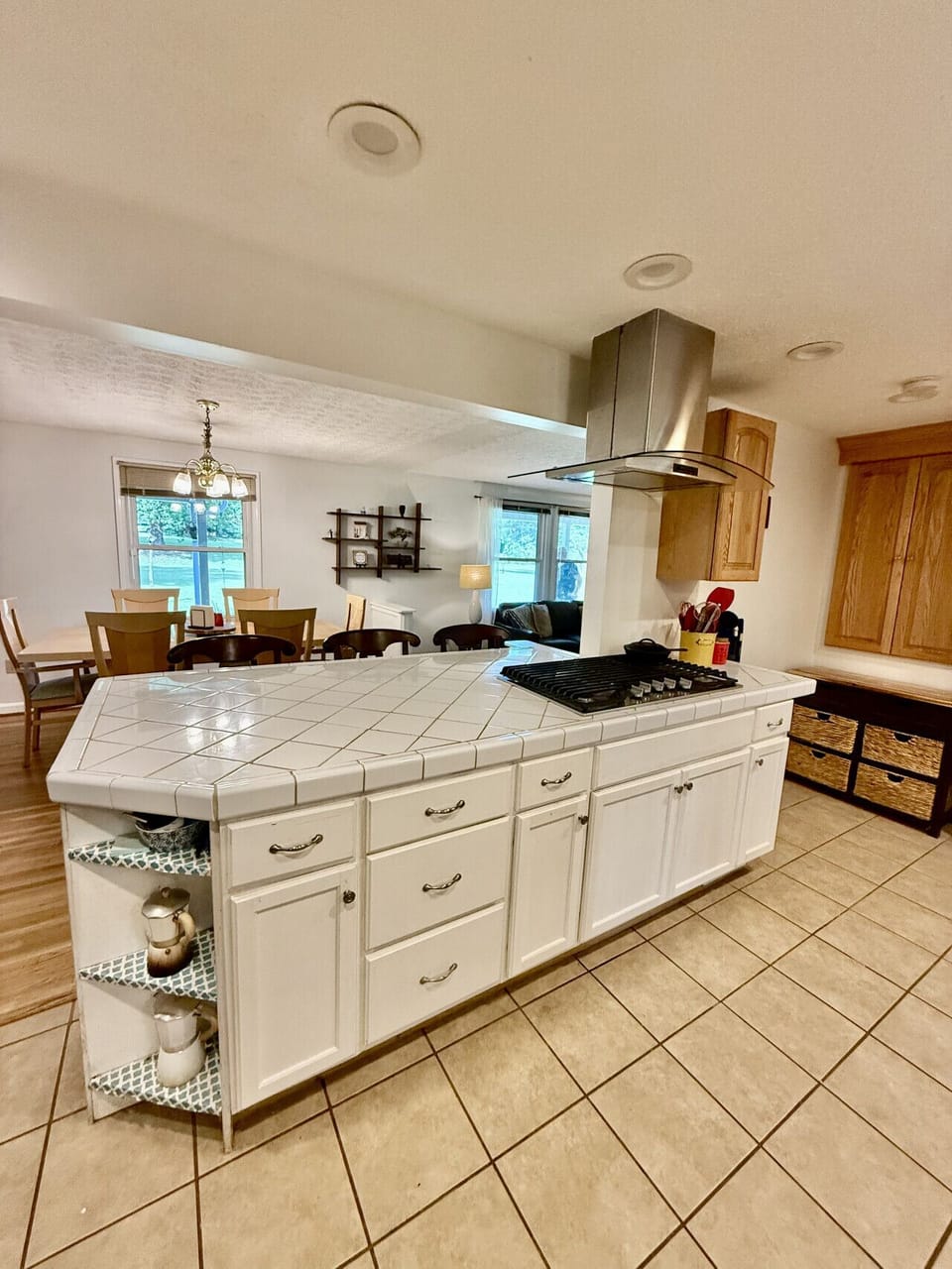 Kitchen island with bar stools and modern appliances.