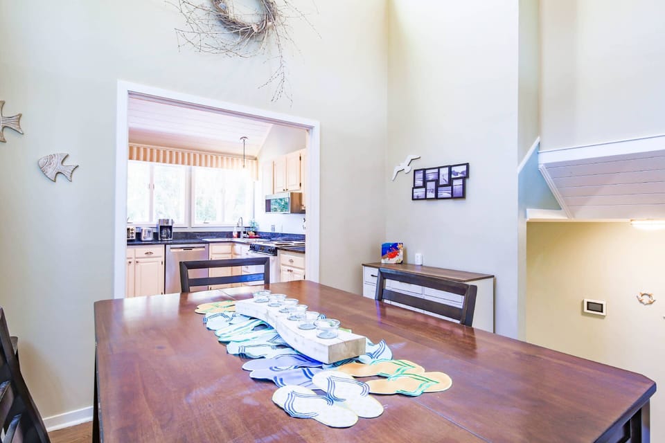 When you climb the half flight of stairs from the entryway, you will find the dining area and kitchen.