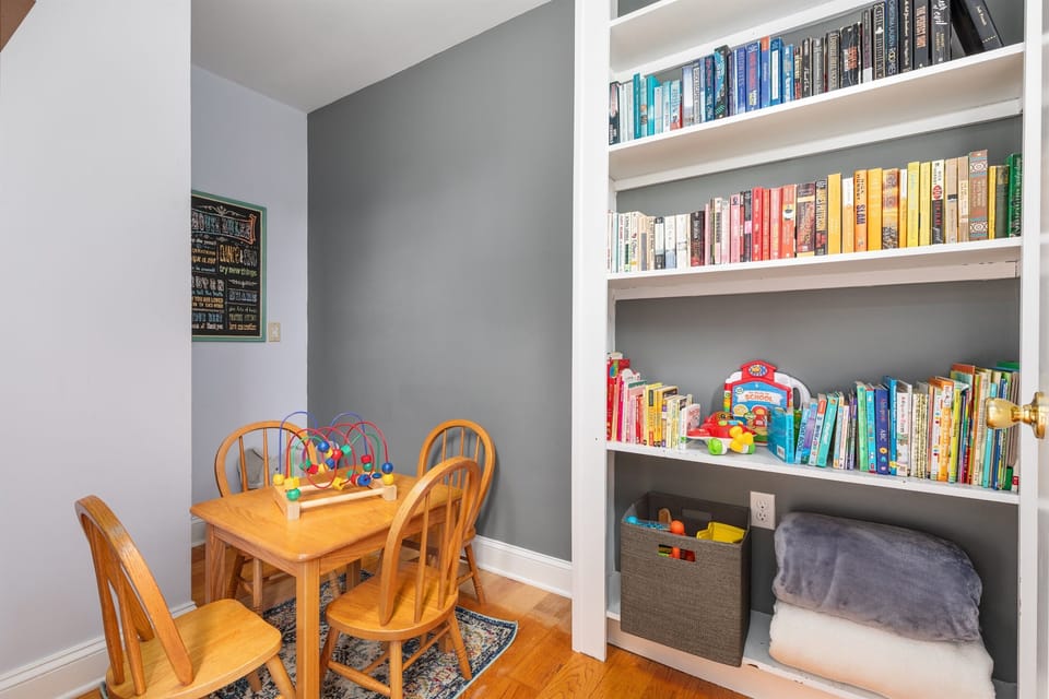 Kids’ nook with books, toys, and games to keep everyone entertained