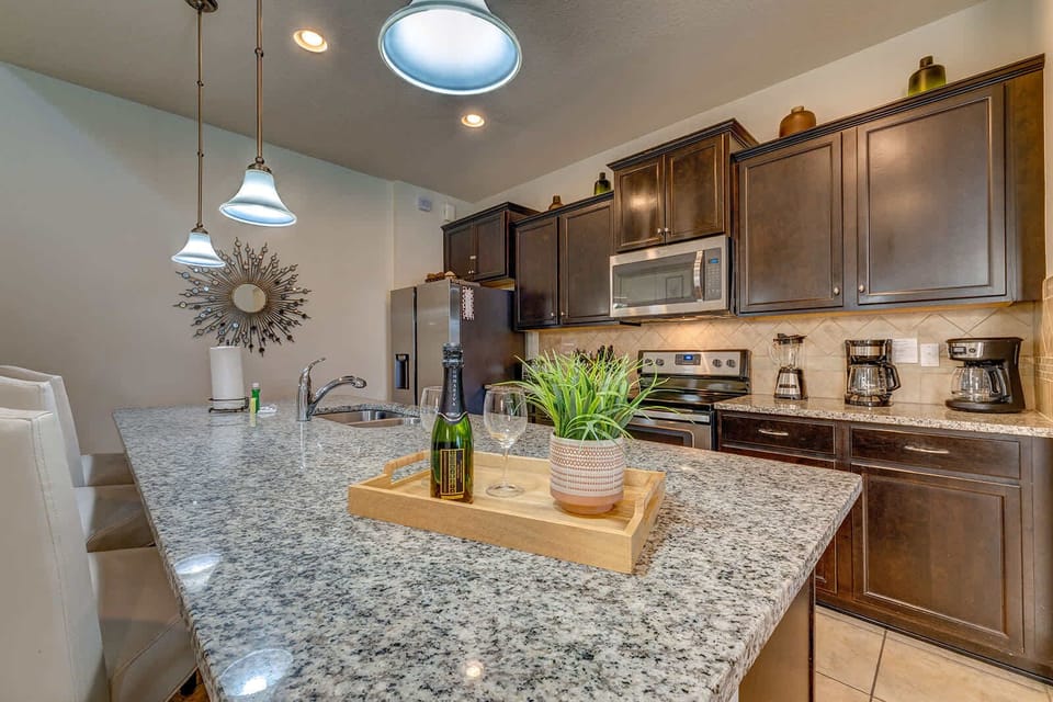 Modern kitchen with granite countertops and stainless steel appliances