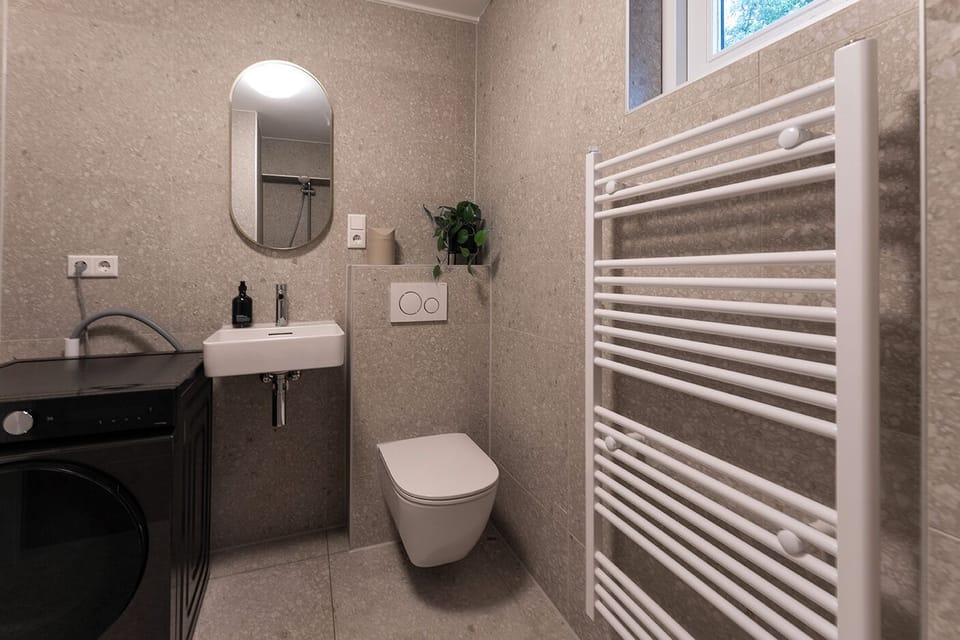 Bathroom via shared-hallway
