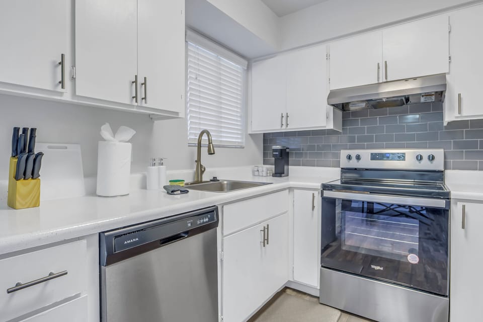  Modern fridge and ample counter space for easy meal prep.