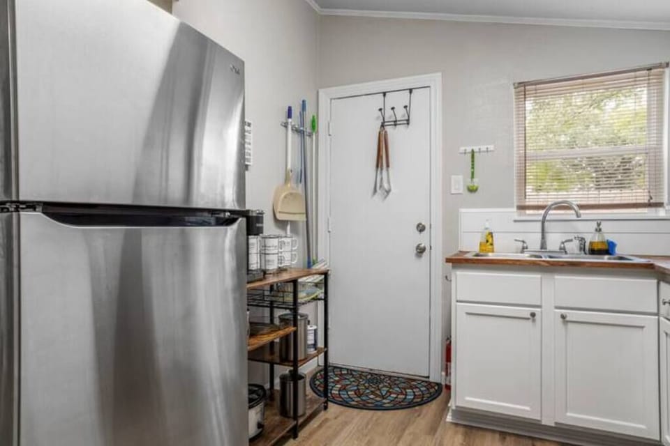 A closer look at the bright and functional kitchen features modern appliances and ample counter space.