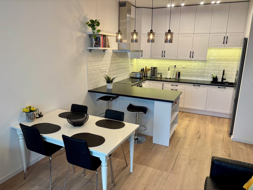 Large counter space kitchen with extra wide induction stove cooktop and hood/fan