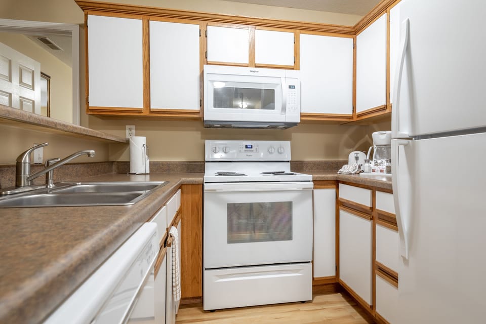 Cook in the fully equipped kitchen with modern appliances and generous counter space.