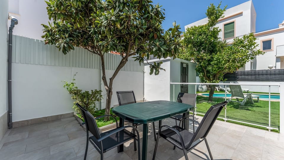 Cool, leafy, and casual outdoor dining spot under natural shade.
#PT #Portugal #Altura #GardenVibes #OutdoorLiving