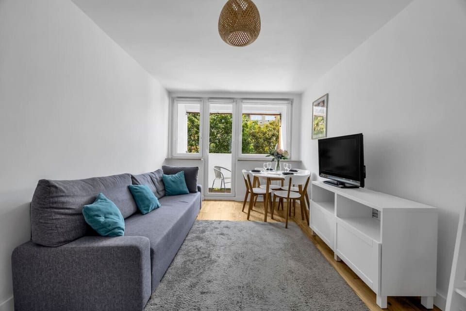 Living Room with Sofa, Smart TV and Dining Table | Book Now with RENTUJEMY.COM