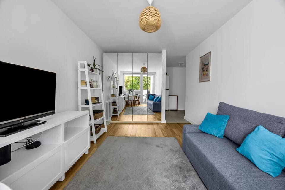 Living Room with Sofa, Smart TV and Dining Table | Book Now with RENTUJEMY.COM